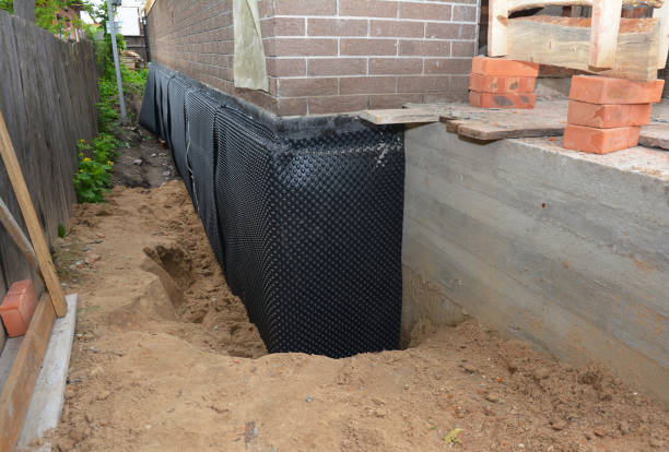 SJ Waterproofing Pros technician performing targeted Waterproofing assessment in Carrollton, VA
